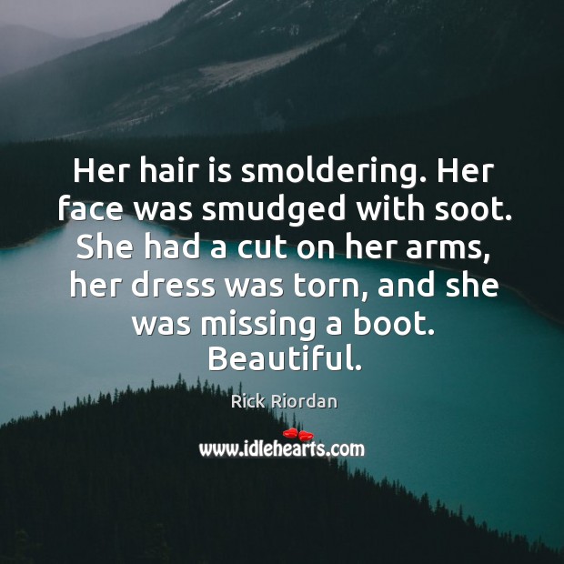 Her hair is smoldering. Her face was smudged with soot. She had Image