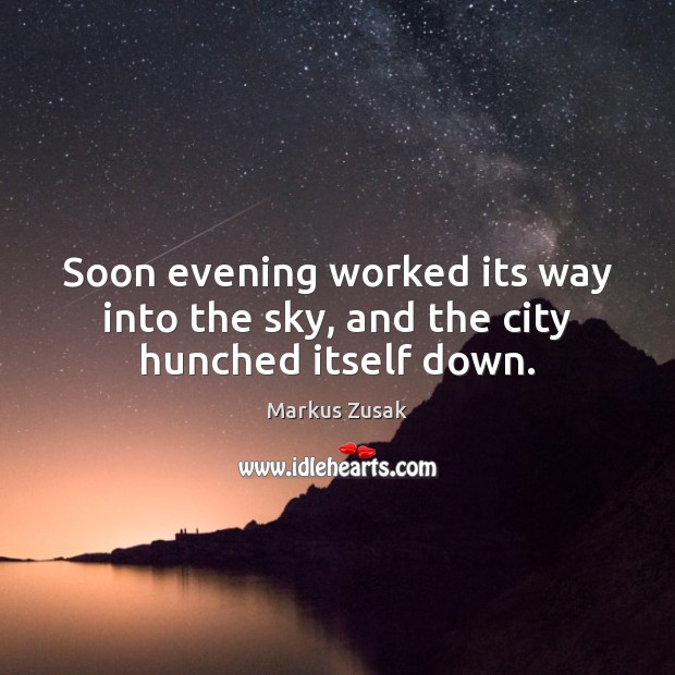 Soon evening worked its way into the sky, and the city hunched itself down. Image